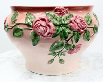 Handmade ceramic flower pot with floral decoration