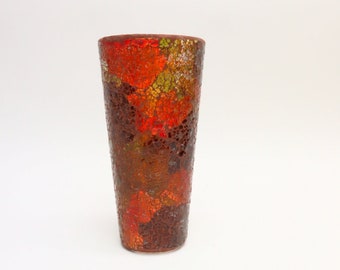 Glass flower vase with colored glass mosaic.