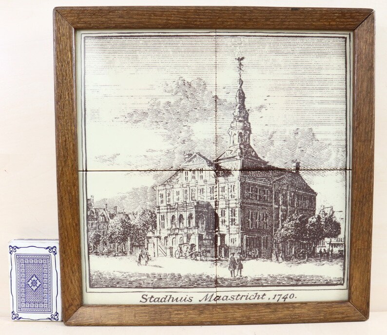 Tile panel with 4 ceramic tiles in a wooden frame.