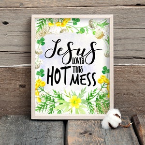 Puede incluir: Una impresi&oacute;n enmarcada con un dise&ntilde;o floral de acuarela y el texto "Jesus loves this hot mess".