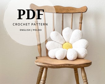 a crochet pattern for a large daisy pillow fits the boho bedroom of a room not only for a child, the amigurumi method spring flower motif