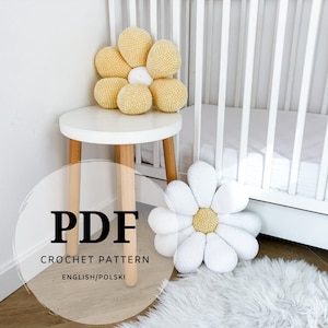 May include: A PDF crochet pattern for a daisy flower pillow in yellow and white. The pattern is available in English and Polish.