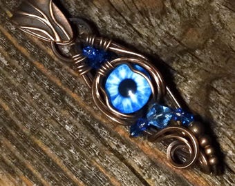 Collier talisman bleu mauvais œil : troisième œil gainé de cuivre, université gothique