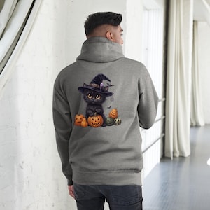 May include: A heather gray hooded sweatshirt featuring a graphic on the back of a fluffy black kitten wearing a purple witch hat, sitting among several orange and green jack-o'-lantern pumpkins with small bats flying in the background.