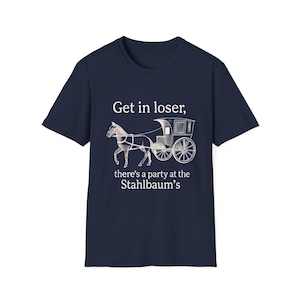 May include: Navy blue t-shirt with a graphic of a horse-drawn carriage and the text "Get in loser, there's a party at the Stahlbaum's". The design is in white and gray.