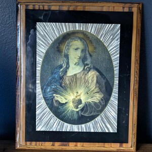 Vintage Sacred Heart of Jesus artwork on wood