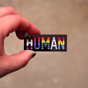 HUMAN ENAMEL PIN, lgbtqia/queer flags by Skyler Orion X