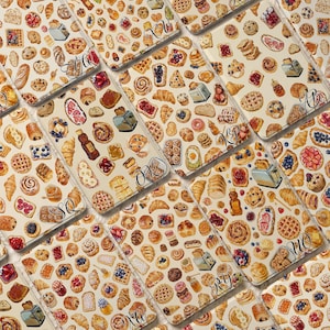 May include: A repeating pattern of breakfast foods including toast, waffles, croissants, donuts, fruit tarts, and honey jars on a light background. Several sections feature small, stylized black cursive monogram letters like SQ, OK, and RY.