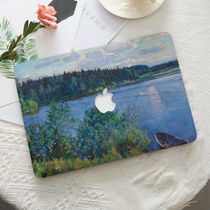 May include: A laptop case featuring a landscape painting of a lake with trees and a boat. The case has a white Apple logo cutout. The artwork is in shades of blue, green, and brown.