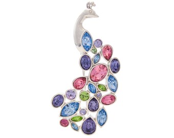 May include: A silver peacock brooch with a colorful crystal design. The peacock is adorned with blue, green, pink, and purple crystals.