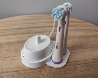 Oral-b iO 6 und älter verfügen über einen Ständer für Ladegerät und 2 Zahnbürstenköpfe mit Farbringen