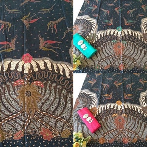 May include: A black fabric with a repeating pattern of stylised birds and floral designs. The fabric has a brown and white border with a more intricate floral design in the centre.