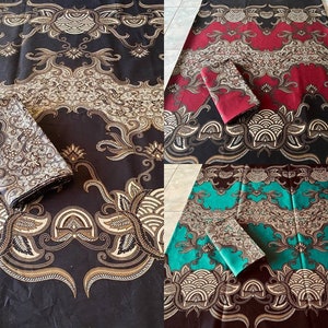 May include: Three rectangular fabric pieces featuring intricate batik-style patterns with swirling floral motifs and geometric wave designs. The textiles are displayed in black, deep red, and teal colorways, each with a folded section of fabric.