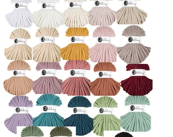 May include: A collection of 9MM braided cord in various colors, including white, beige, mustard yellow, pink, and teal. Each spool is labeled with the "Bobbiny" brand name. The image displays a range of hues suitable for crafting projects.