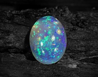 AAA Ethiopische Welo Opal cabochon: natuurlijke witte regenboog edelsteen (14 x 10 mm)