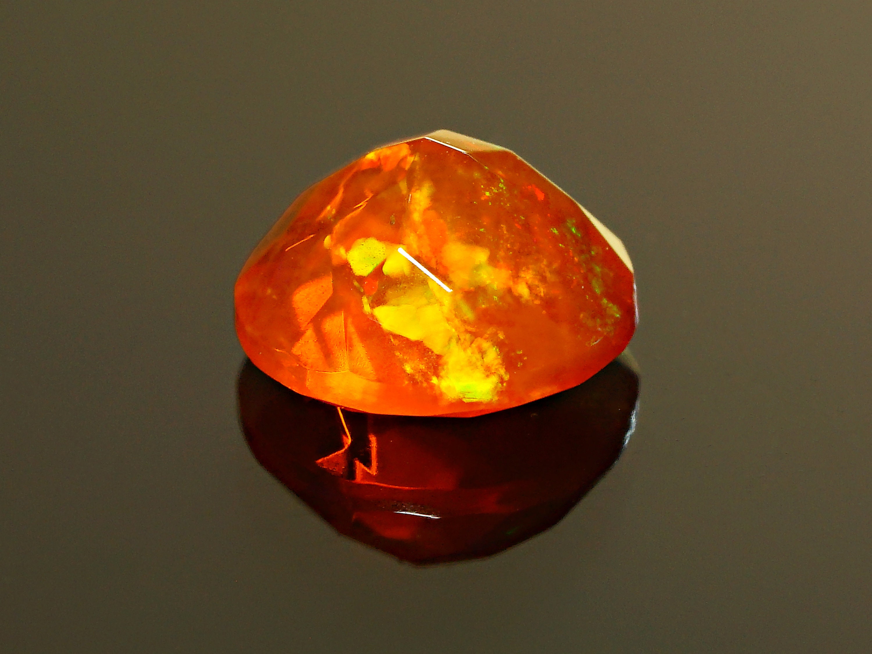 thumbnail image 2 of Natural Ethiopian Welo Opal – 7mm Round Faceted, Multi-Fire, Calibrated, Unbranded 2 of 2
