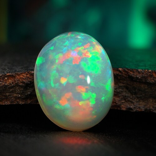 AAAA Grade Ethiopian Opal Gemstone: 11x9mm Oval Cabochon, Welo Pin Fire Natural Play-of-Color Opal
