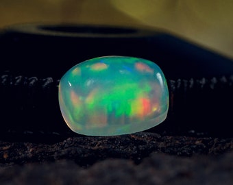 Ethiopische Welo Opal cabochon: 7 x 5 mm witte regenboog edelsteen