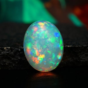 natural ethiopian white opal oval shape cabochon loose gemstone for jewelry supply. october birthstone