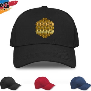 May include: A black baseball cap with a gold geometric design on the front. The cap is available in black, red, and navy blue.