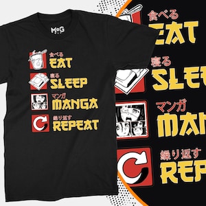 Puede incluir: Camiseta negra con un diseño gráfico blanco. El gráfico presenta una lista de actividades en japonés e inglés: Comer, Dormir, Manga, Repetir.