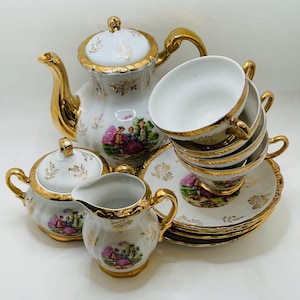 Japanese 12 Piece Lustreware Gold Porcelain Courting Couple Teaset