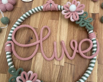 Sage green and blush pink name hoop with handmade flower details.