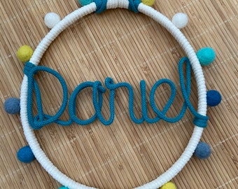 Winter white and teal personalised name hoop with pompom detailing