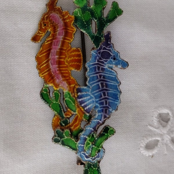 Vintage Two Seahorse Pin/Brooch. One Orange Tones and One Blue Tones. Painted Enamel. Measures 2” long and 3/4” wide