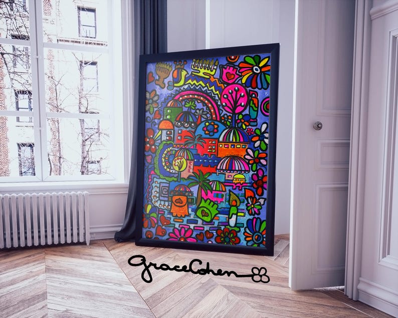 Puede incluir: Una obra de arte abstracta colorida enmarcada en un marco negro. La obra presenta una vibrante mezcla de formas, incluyendo flores, edificios y un arco&iacute;ris, en tonos de rojo, azul, verde y amarillo. La firma del artista, "graceCohen", es visible.
