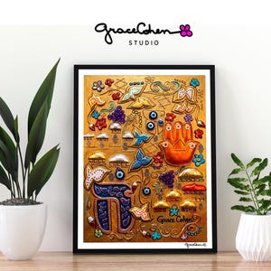 May include: Framed artwork with a gold background featuring a Hamsa hand, butterflies, and floral designs. The artwork includes the text "Grace Cohen Studio" and is displayed with potted plants.