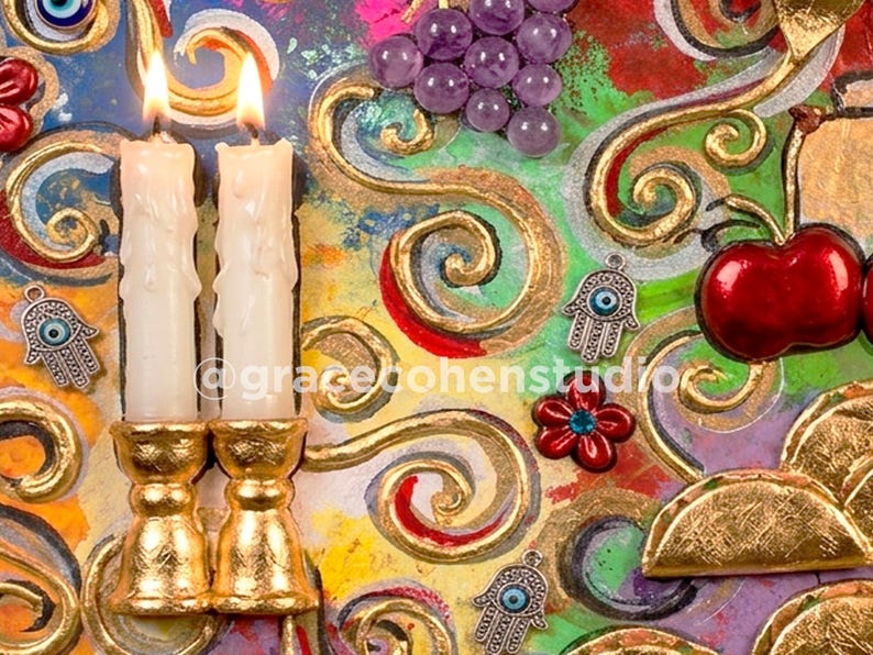 May include: An artistic composition featuring two lit candles in gold candle holders, red cherries, purple grapes, and decorative charms. The background is a vibrant mix of colors and swirling gold accents, with the text "@gracebonenstudio".