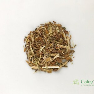 May include: A pile of dried, light brown and yellow herbs. The herbs are loose and appear to be a blend of different types.