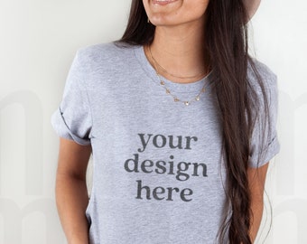 Può includere: Una t-shirt grigia melange con la scritta "your design here" stampata sul davanti.