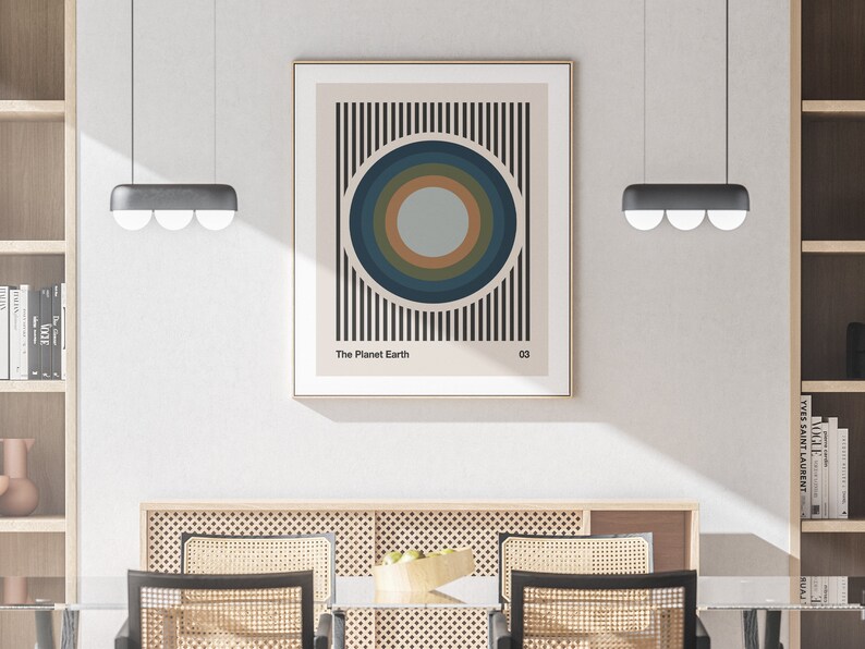 May include: A minimalist poster with a black and white striped background and a concentric circle design in shades of blue, green, and brown. The text "The Planet Earth" and "03" are printed at the bottom of the poster.
