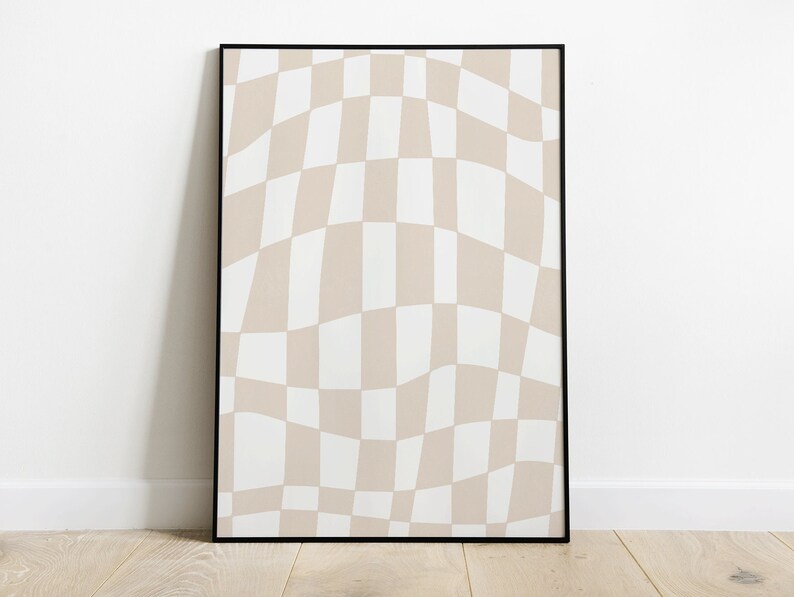 May include: A black framed print featuring a wavy checkered pattern in beige and white.