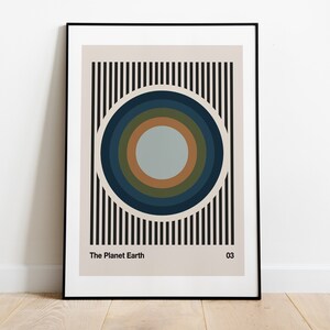 May include: A black and white striped background with a concentric circle design in shades of blue, green, and brown. The text "The Planet Earth" and "03" are at the bottom of the image.