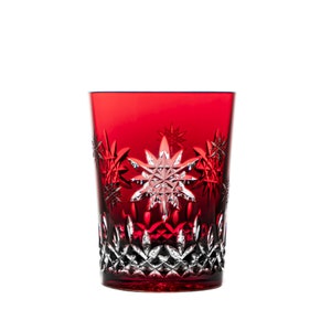 May include: A red glass tumbler with a snowflake design. The glass is clear and has a cut-glass pattern.