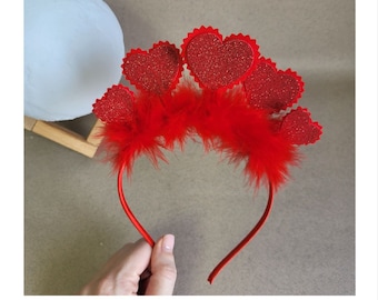 May include: Red headband with red glitter hearts and red feathers.