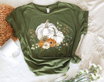 T-shirt med pumpamotiv, dammodell med grafisk design