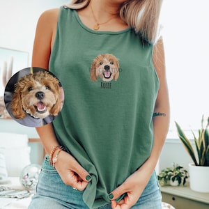 May include: A green tank top with an embroidered dog portrait and the name "Rosie" below. A circular image of the dog is on the left. The tank top is knotted at the waist.