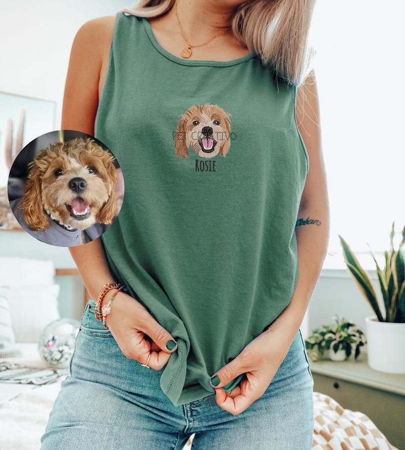 May include: A green tank top with an embroidered dog portrait and the name "Rosie" below. A circular image of the dog is on the left. The tank top is knotted at the waist.