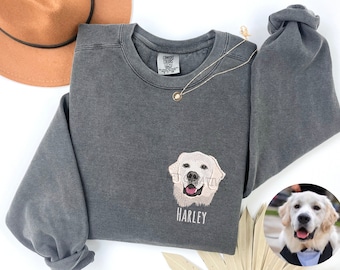 May include: A gray sweatshirt with a white embroidered image of a dog's head and the name "Harley" underneath.