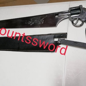 Può includere: Una Countssword, un'arma ibrida che combina una rivoltella con una grande lama. La lama presenta un'incisione decorativa. L'impugnatura è grigia e l'arma include un fodero in pelle nera. Il testo "The countssword" è scritto in rosso.