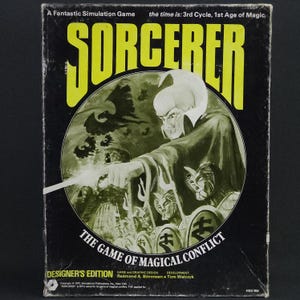 May include: A vintage board game box titled "SORCERER" with a fantasy illustration. The cover features a wizard figure, a dragon, and the text "THE GAME OF MAGICAL CONFLICT". The box is black with yellow and green accents.
