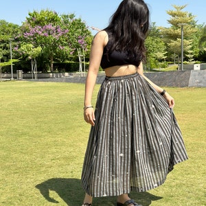 The Breeze Skirt is a handwoven summer garment from Fulia, handwoven cotton, featuring pocket and flowing length for effortless movement. image 2