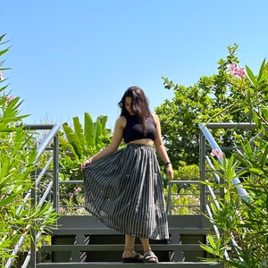 The Breeze Skirt is a handwoven summer garment from Fulia, handwoven cotton, featuring pocket and flowing length for effortless movement. image 8