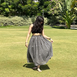 The Breeze Skirt is a handwoven summer garment from Fulia, handwoven cotton, featuring pocket and flowing length for effortless movement. image 6