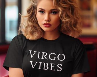 以下が含まれることがあります： 白い文字で「VIRGO VIBES」と書かれた黒いTシャツです。