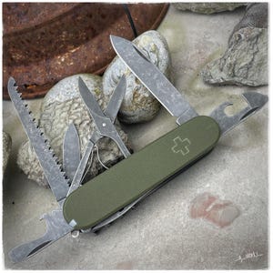 Custom modified Victorinox, SAK Huntsman with green G10 + scales, acid- and stonewashed tools and black liners.